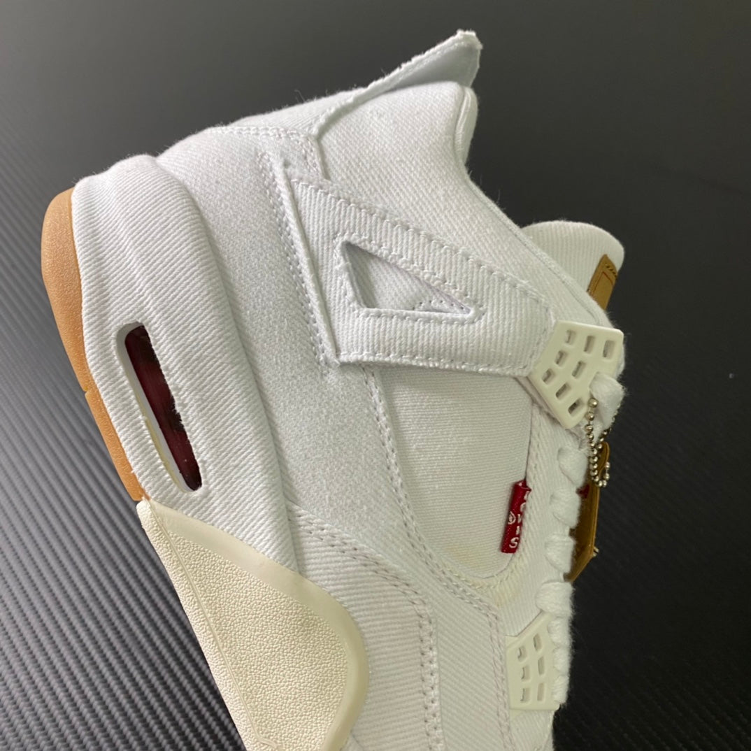 White high-top sneakers with side cutout, red emblem on strap, gum sole