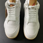 White high-top sneakers with laces and embossed side panels, gum soles