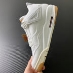 White high-top sneakers with side strap and vent cutouts, gum sole