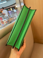 Green Fendi mini handbag back view with structured panels and top handle loops