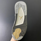 Rubber outsole with herringbone tread and gold Jumpman logo on light gray base