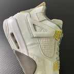 Mid-top sneaker side and heel with off-white leather, beige suede, and yellow lace strap