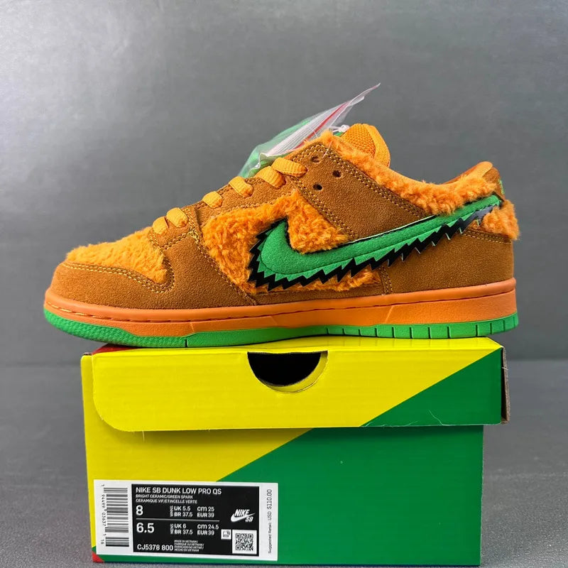 Orange-and-brown plush low-top sneakers with green swoosh and green rubber sole