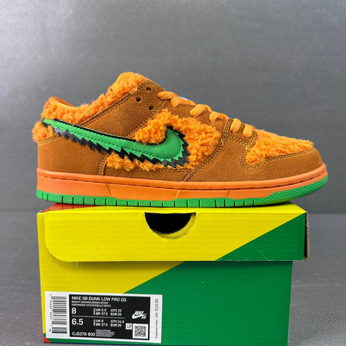 Orange-brown low-top sneaker with green stitched swoosh and fuzzy lining