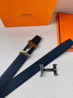 Leather belt with dark blue strap and silver-toned H buckle
