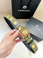 Dark navy leather belt with gold baroque pattern and Medusa gold-tone buckle