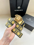 Navy leather belt with repeating gold oval pattern and ornate gold Medusa buckle