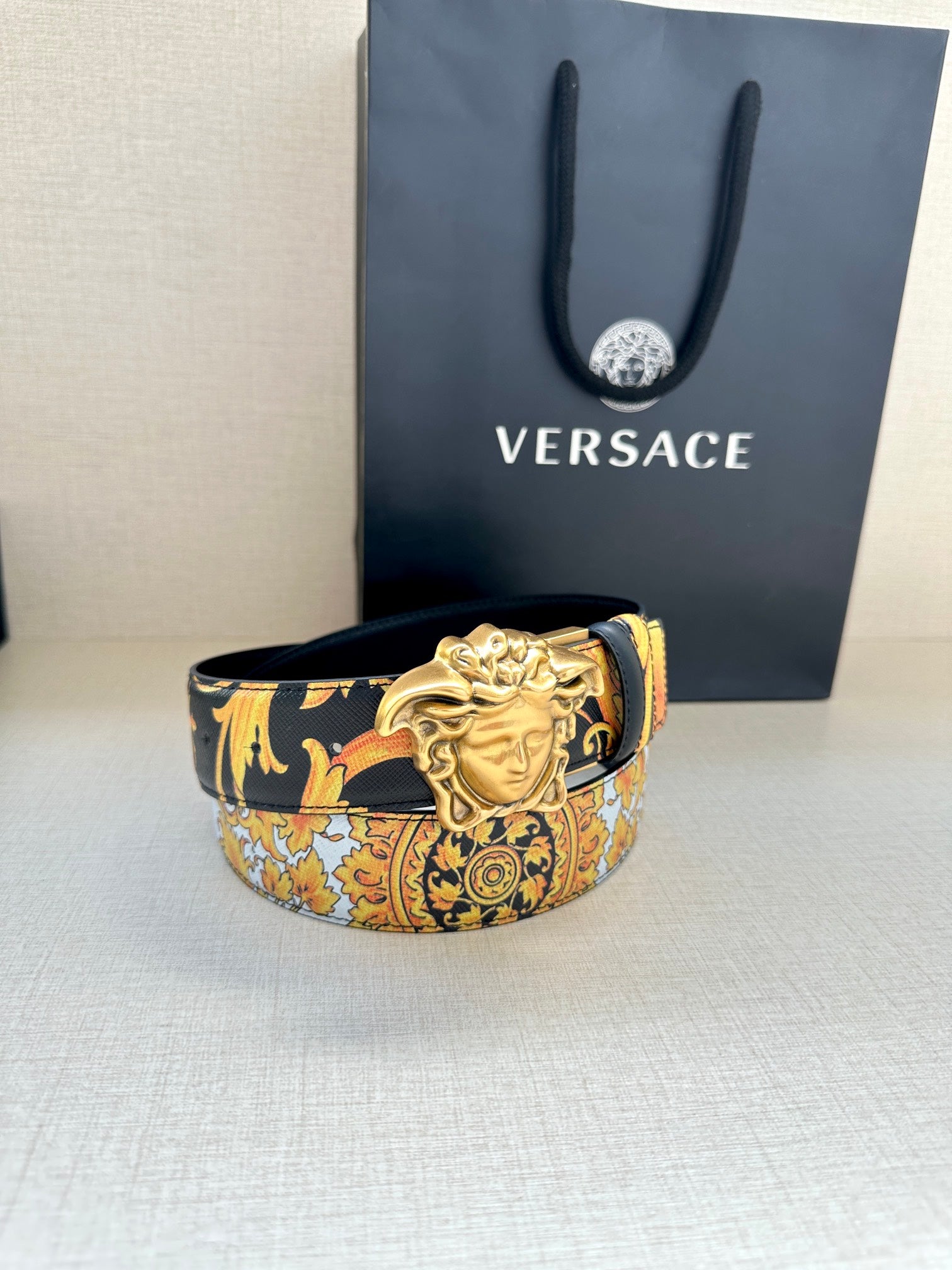 Versace belt with dark blue baroque print strap and gold-toned Medusa buckle