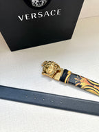 Versace belt with dark blue leather strap, gold buckle, and patterned tip