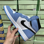Side view high-top sneakers in light blue, white, and black with blue outsole.