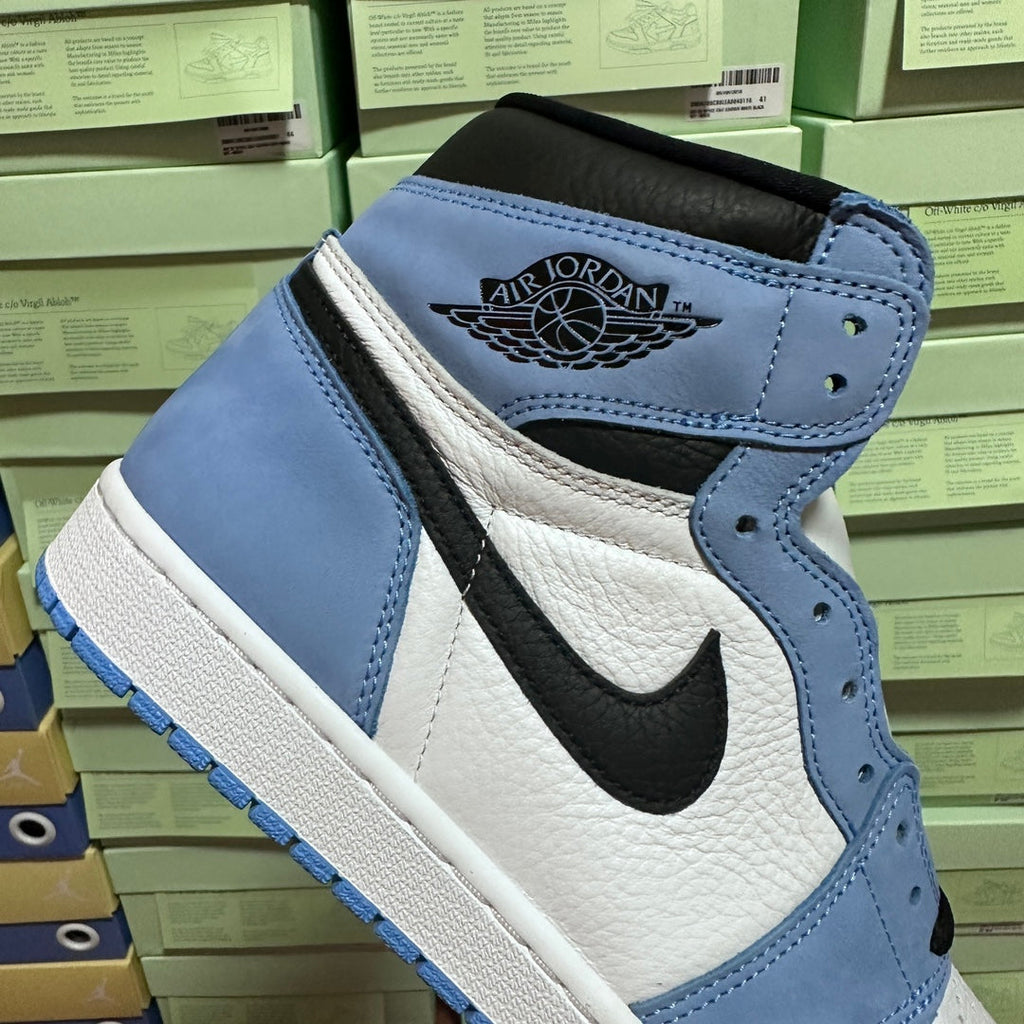 Light blue and white high-top sneakers with Air Jordan logo on ankle strap.