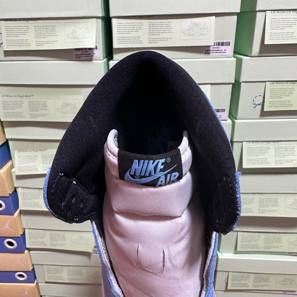 High-top sneaker heel view with Nike Air logo on inner lining.