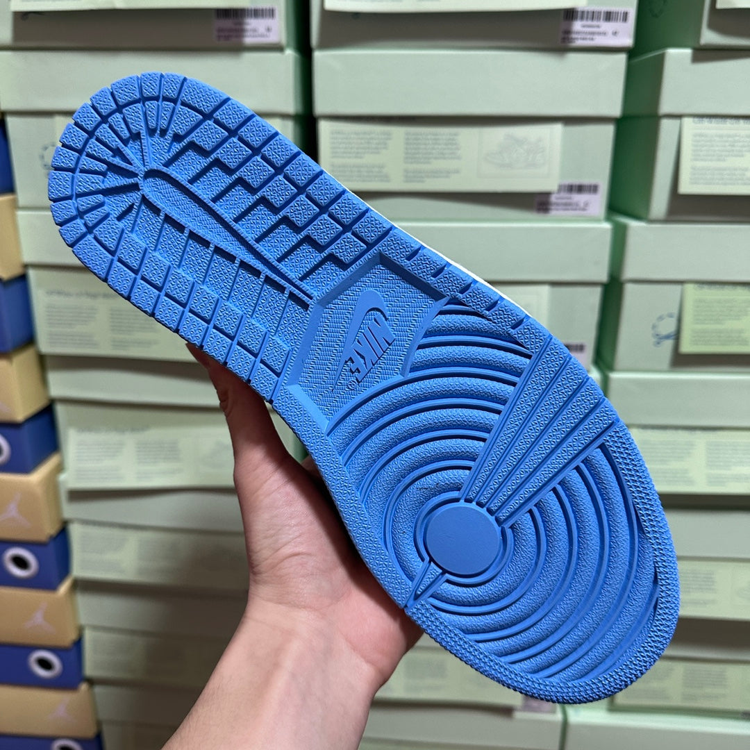 Light blue sneaker outsole with textured tread and circular traction pattern.