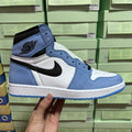 High-top sneakers in light blue, white, and black with Nike swoosh detail.