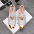 Luxury Versace loafers in white sparkle with gold crest embellishment and metallic toe