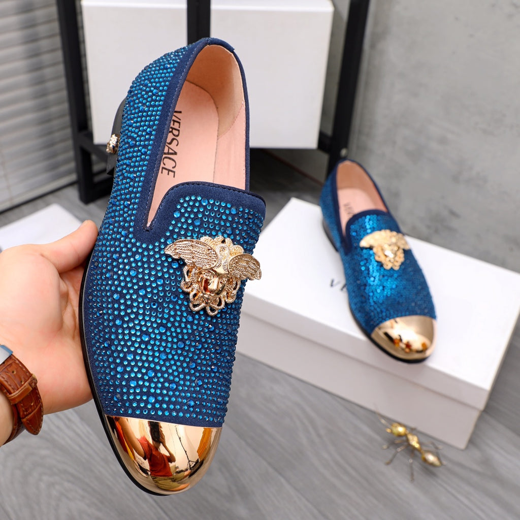 Blue rhinestone loafers with gold lion emblem, V-cut vamp, slip-on