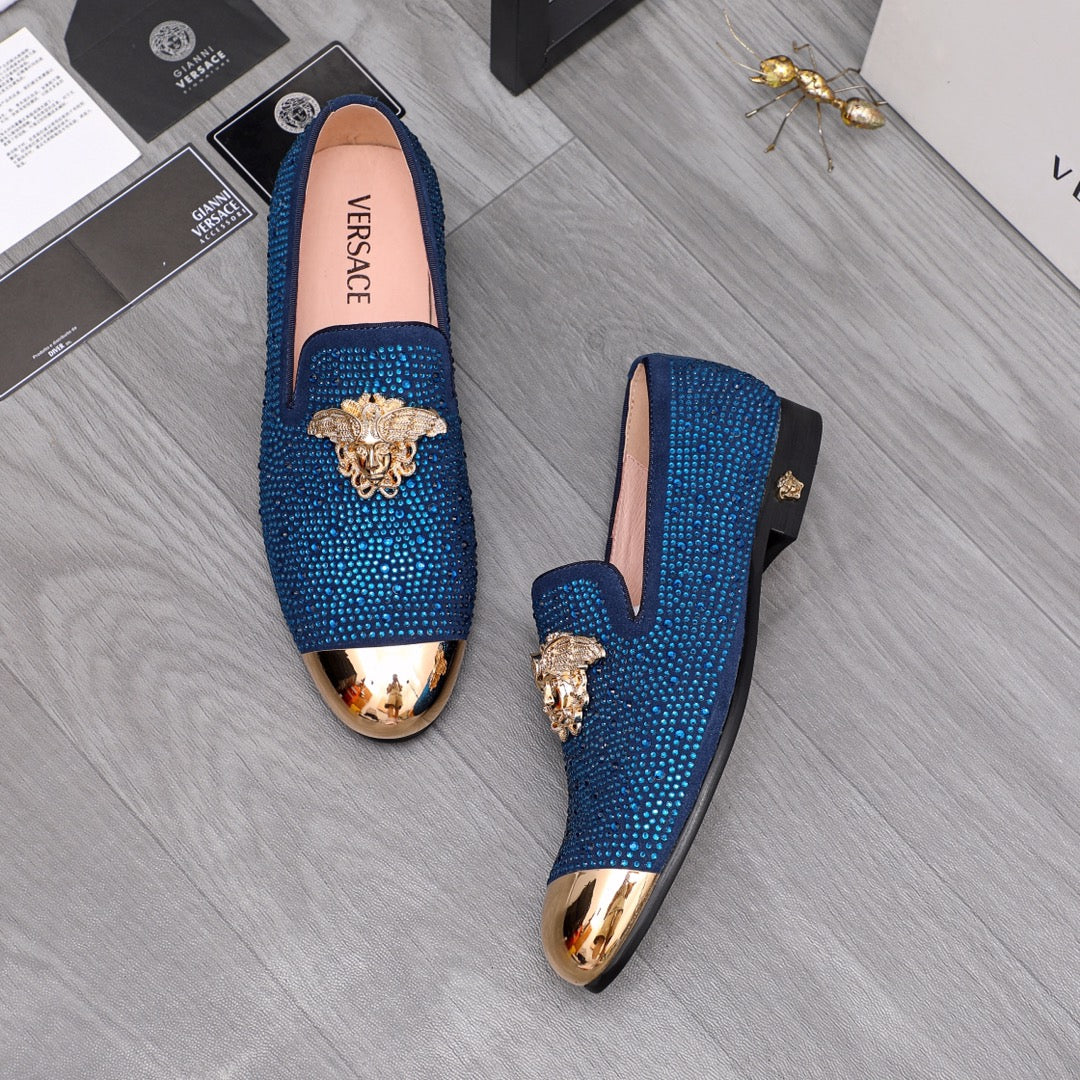 Blue rhinestone Versace loafers with gold lion emblem, pair view, slip-on