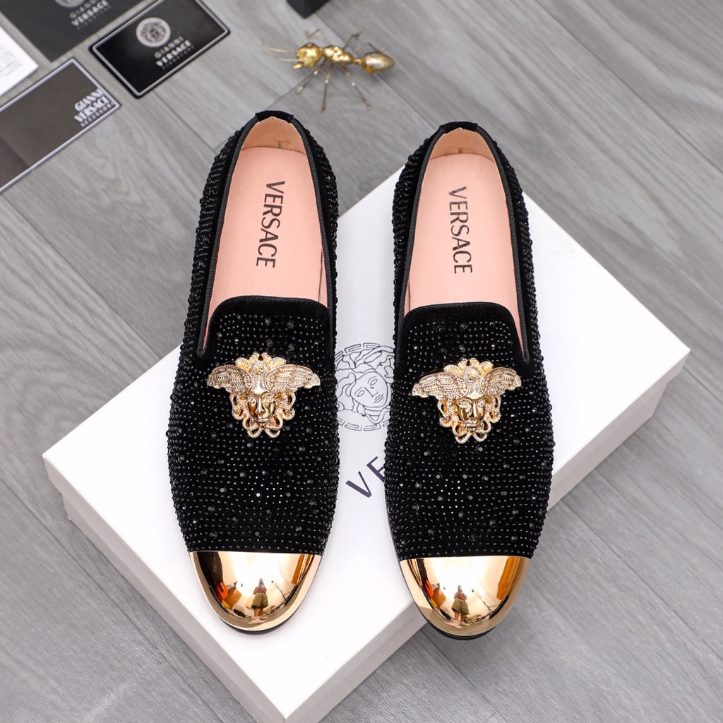 Versace embellished loafers with black glitter uppers and gold-toned toe caps