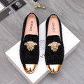 Versace embellished loafers with black glitter uppers and gold-toned toe caps