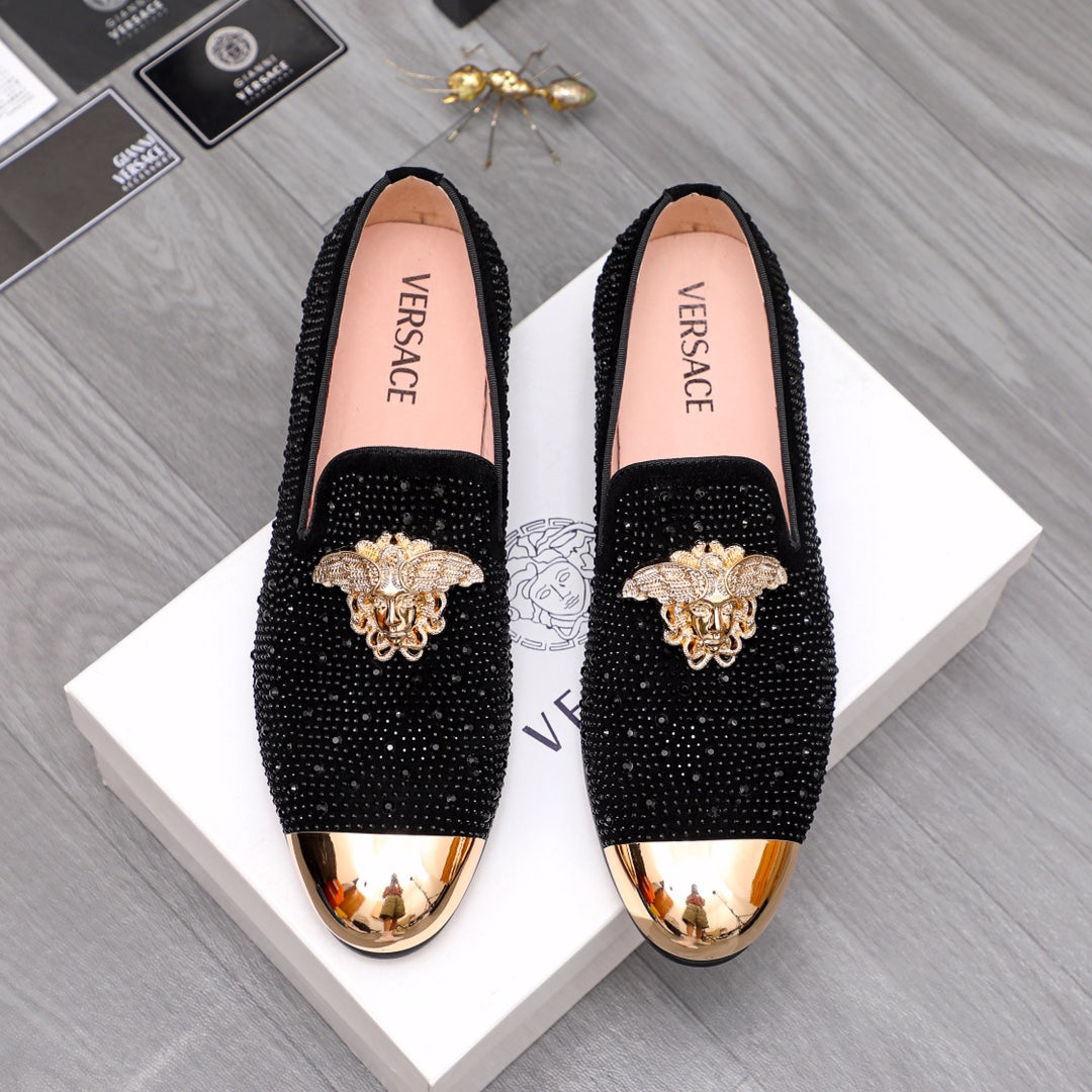 Versace embellished loafers with black glitter uppers and gold-toned toe caps