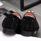 Versace black loafers back view with textured uppers and low black sole