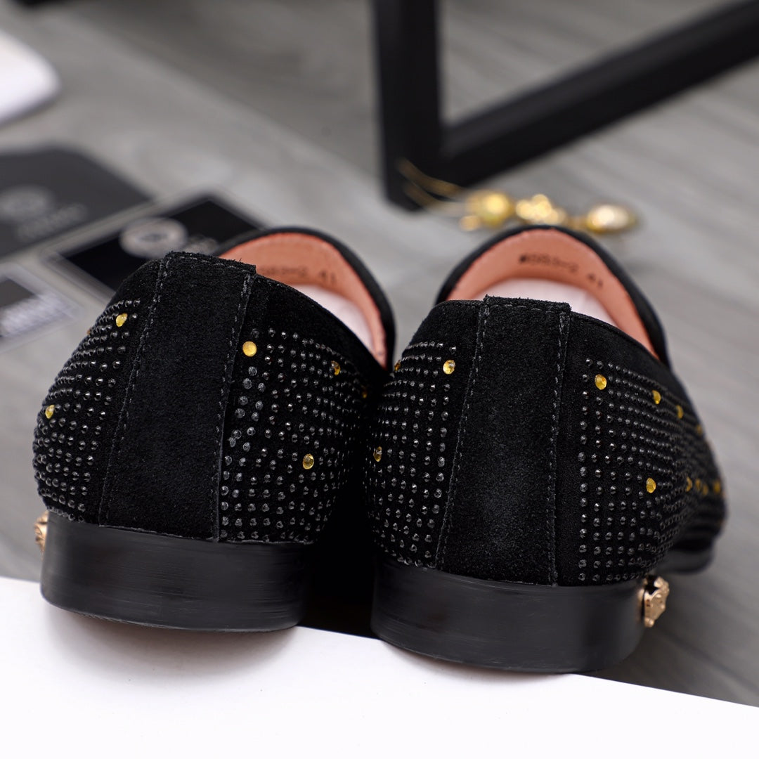 Versace black loafers back view with textured uppers and low black sole