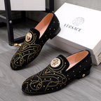 Pair of Versace black embellished loafers with gold crest buckle and studs