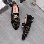Versace black slip-on loafer set with gold stud trim and crest emblem