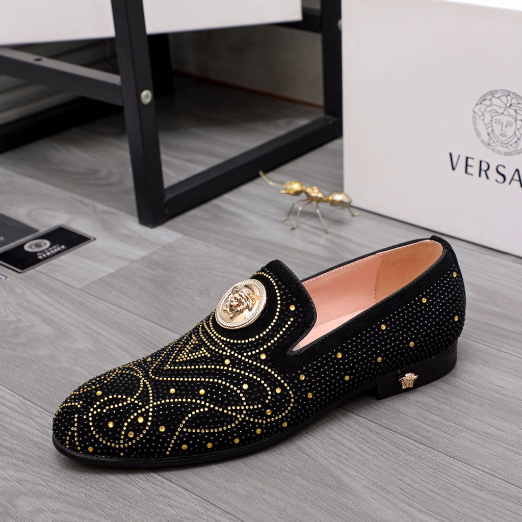 Versace black embellished loafer with gold stud pattern and round crest badge