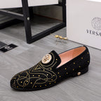 Versace black embellished loafer with gold stud pattern and round crest badge