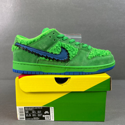 Neon green low-top sneaker with blue swoosh and fuzzy trim, green laces