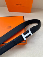 Dark blue leather belt with silver H buckle and stitched edge detail