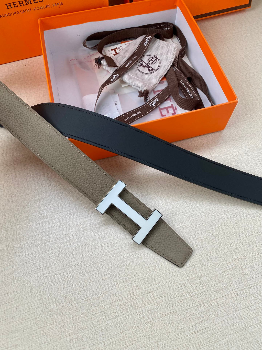 Hermes reversible leather belt with silver H buckle, gray with dark navy trim