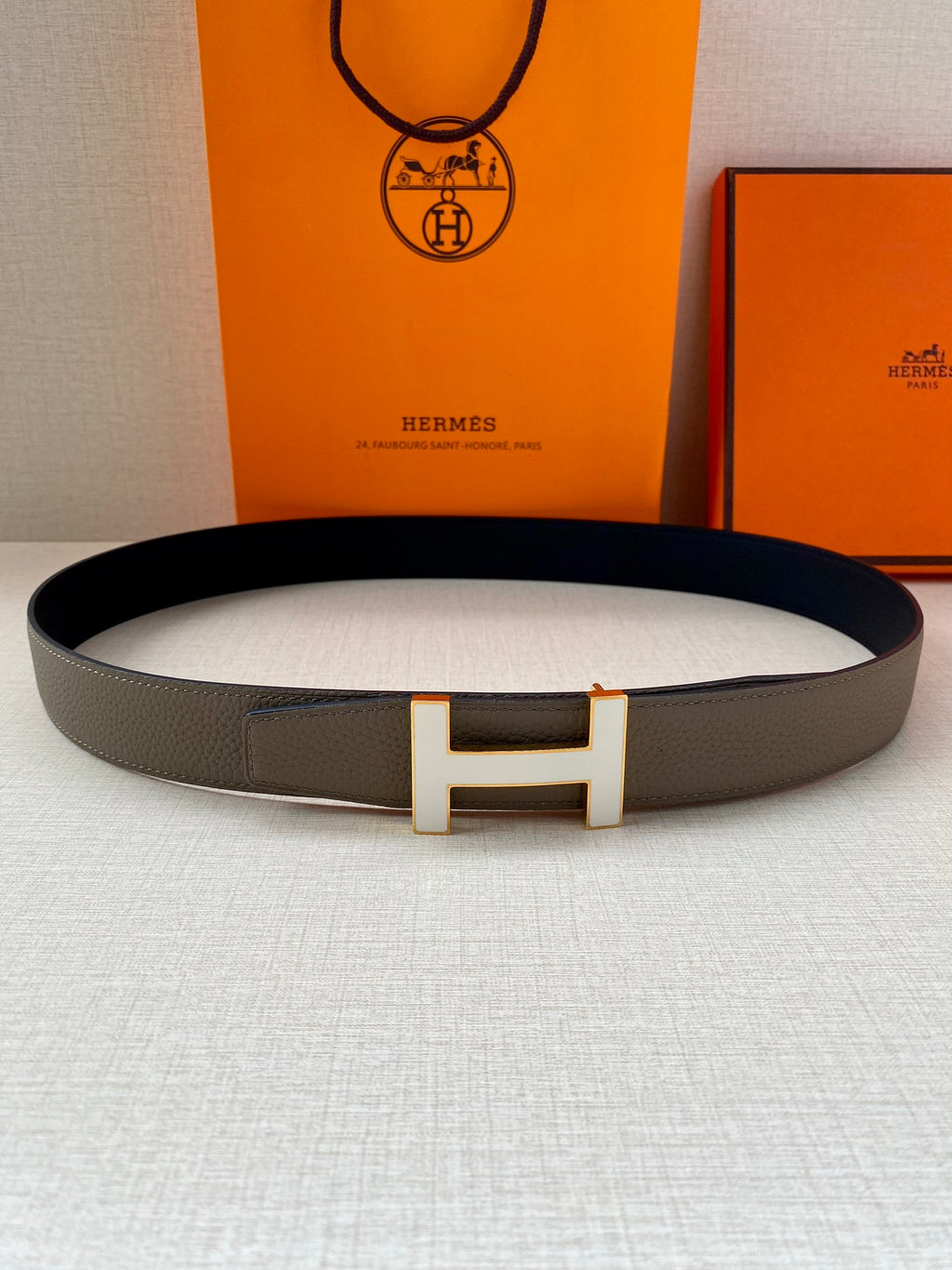 Hermes leather belt with silver H buckle, textured gray strap