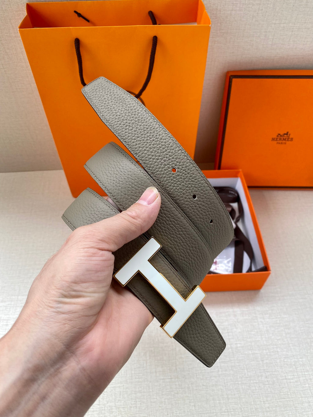 Hermes leather belt with silver H buckle, textured gray strap