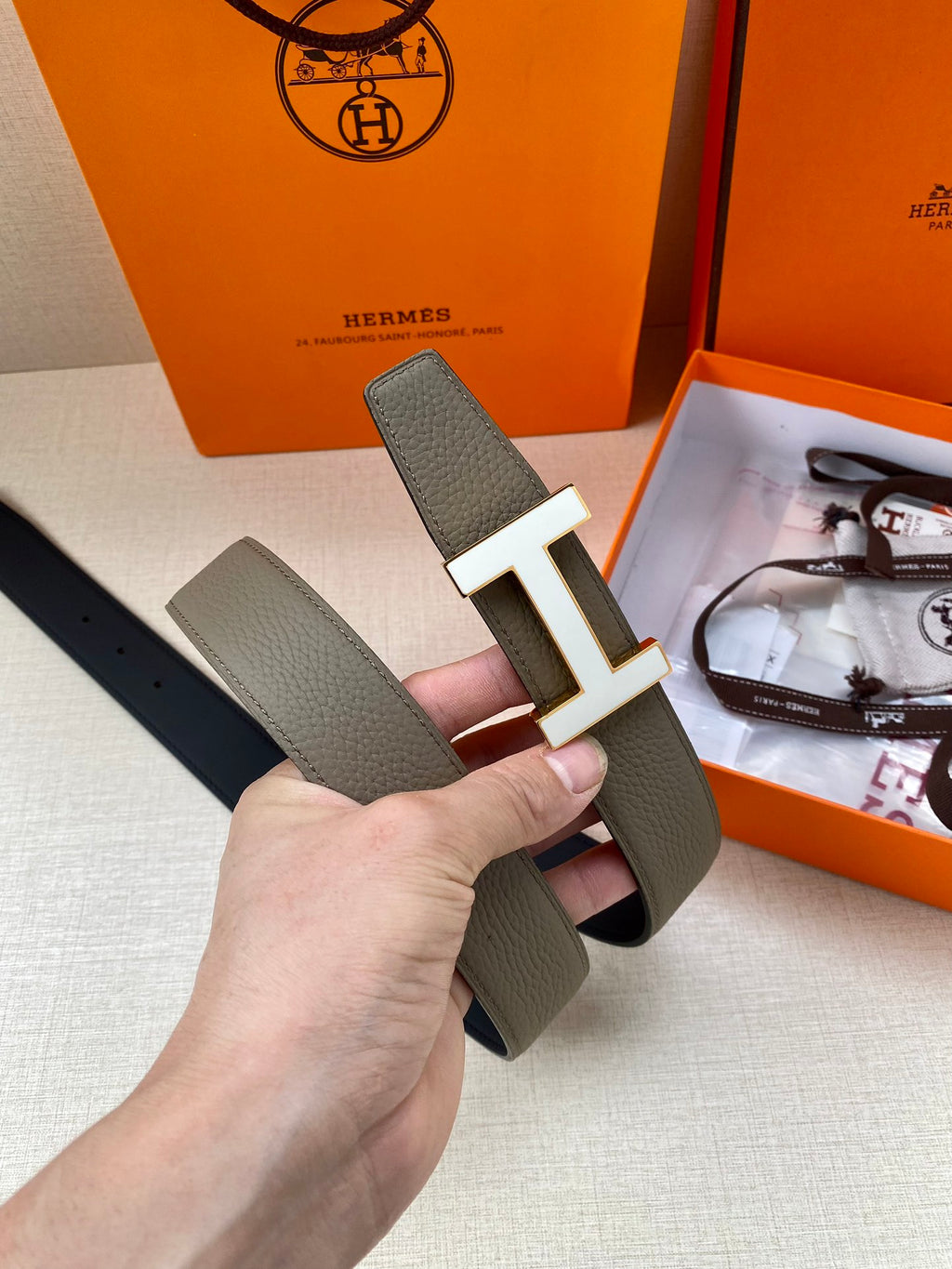 Hermes leather belt with silver H buckle, textured gray strap detail