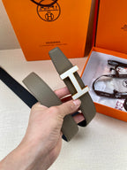 Hermes leather belt with silver H buckle, textured gray strap detail