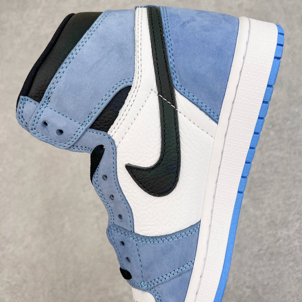 High-top sneaker quarter panel with black Swoosh and blue suede overlays