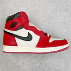 High-top sneakers with red, white, and black panels and classic midsole