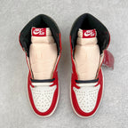 Pair of high-top sneakers with red uppers, white toe box, and black lining