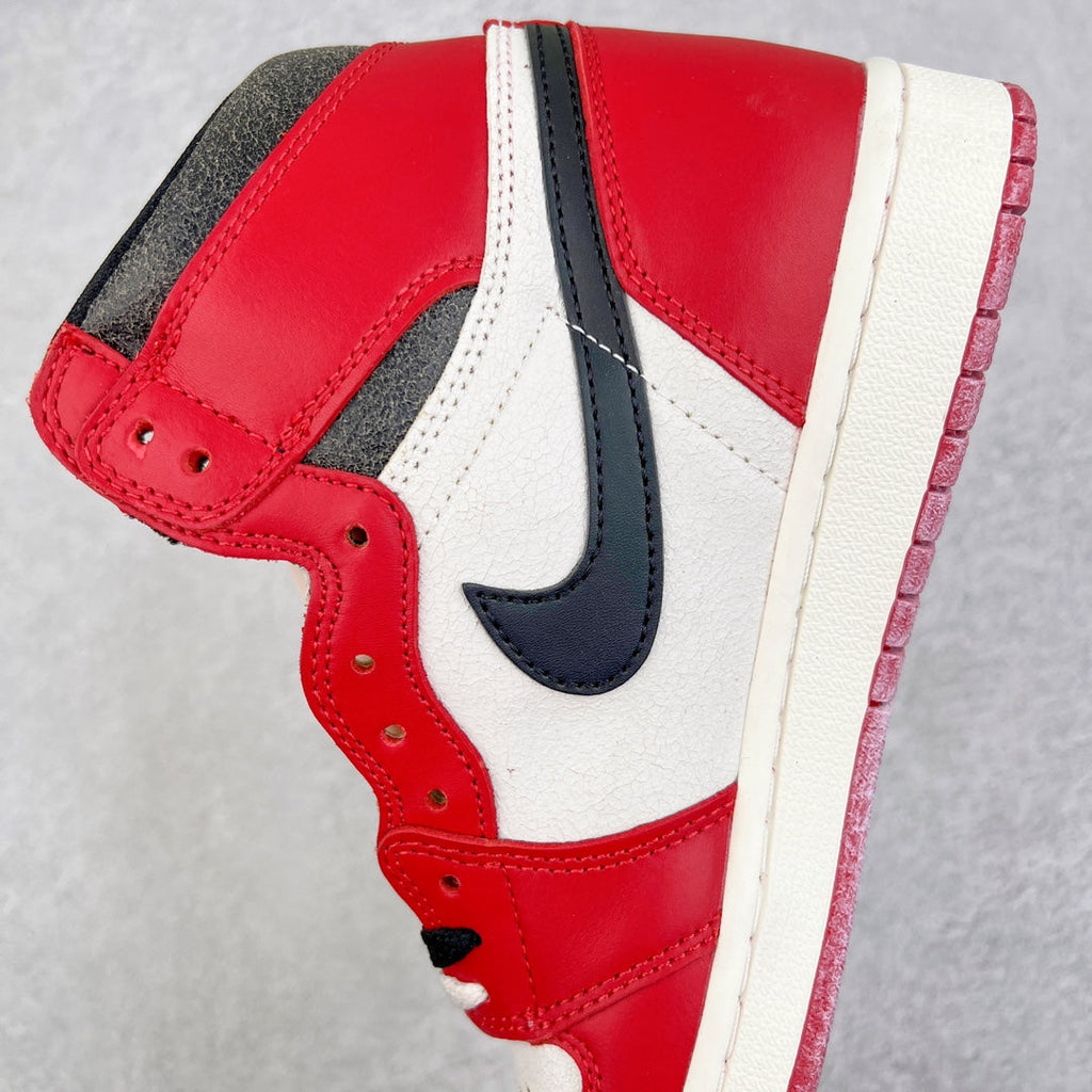 High-top sneaker quarter view with red leather, black swoosh, and white midsole