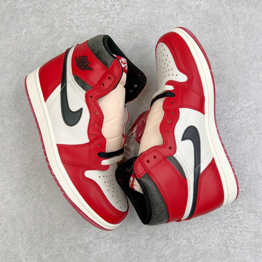 Two high-top sneakers in red, black, and white with visible laces and swoosh