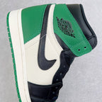 High-top sneaker quarter panel with green strap and black emblem over white and black leather