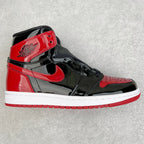 High-top patent leather sneaker, black and red with Nike swoosh and white sole.