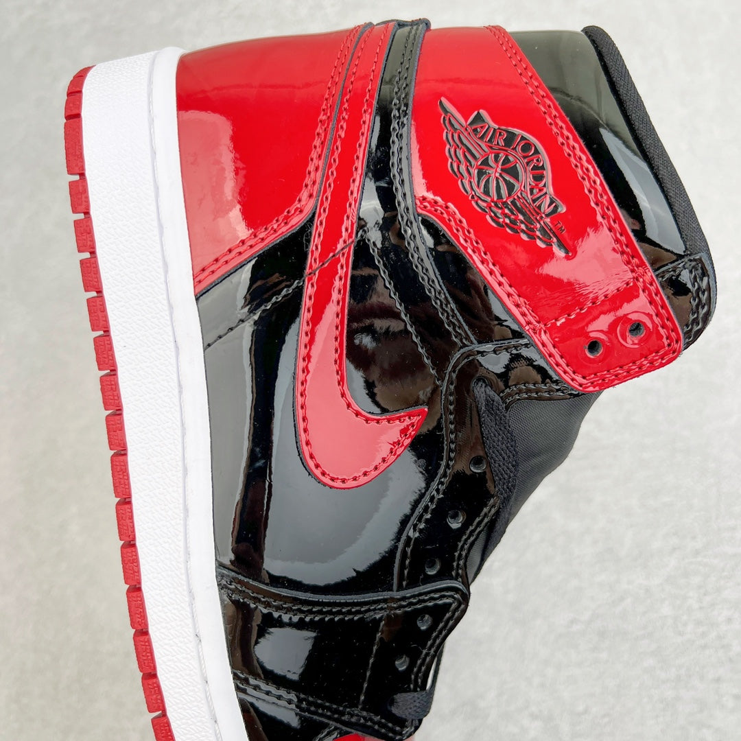 High-top sneaker with red collar panel, black overlays, and wing logo on ankle.
