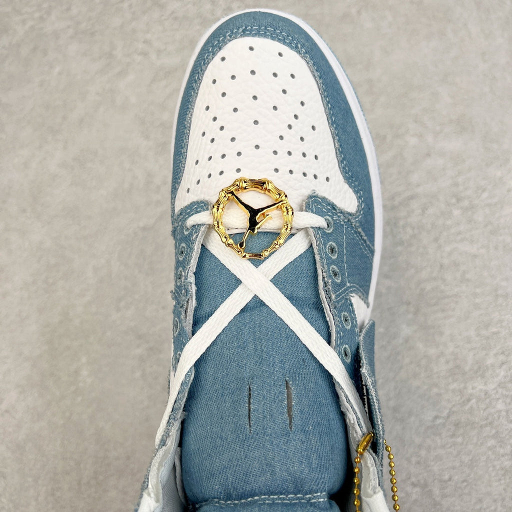 Denim blue and white high-top sneaker toe close-up with perforations, gold lace charm