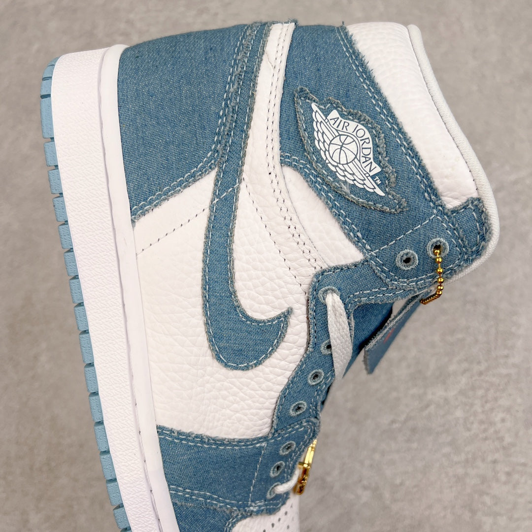 Denim blue and white high-top sneakers with Air Jordan wing patch and gold chain charm