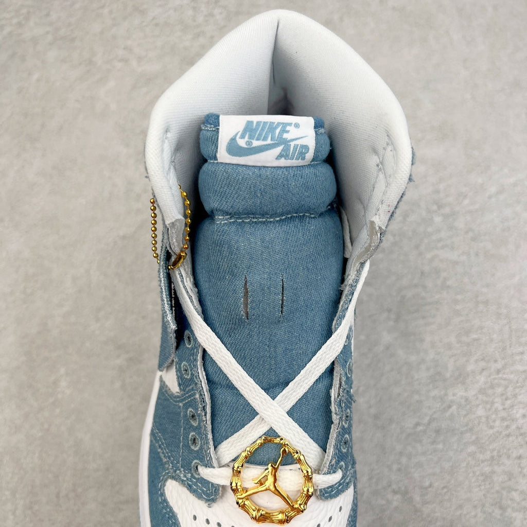 Denim blue high-top sneaker interior view with Nike Air tongue, gold lace charm and laces