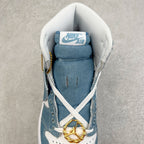 Denim blue high-top sneaker interior view with Nike Air tongue, gold lace charm and laces