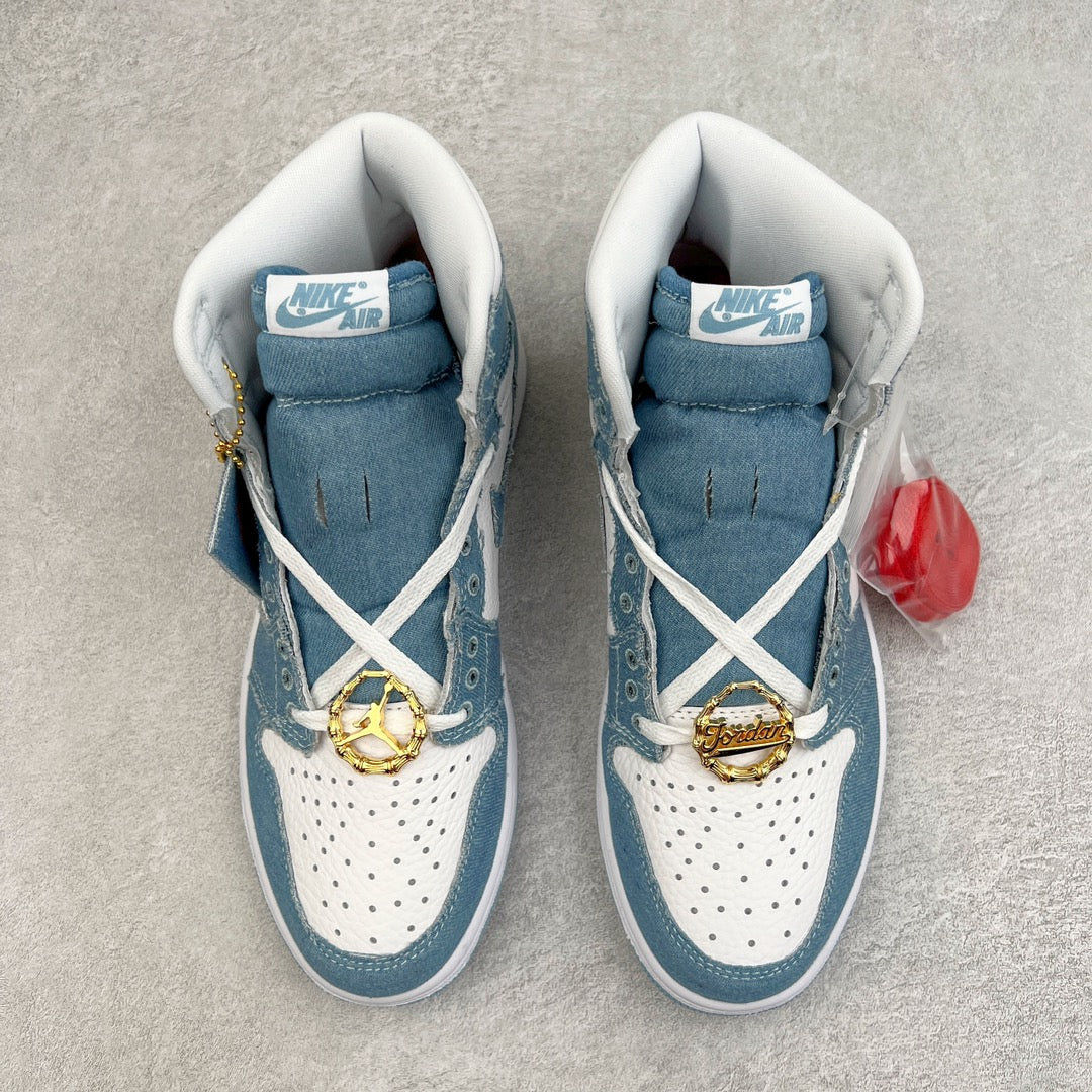 Denim blue high-top sneakers with white laces, Nike Air tongue label, gold chain charms